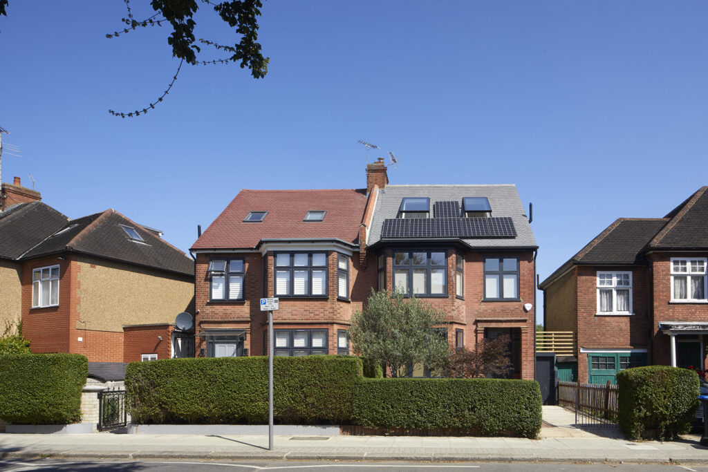 image of the front of a house with A six solar panel array at our Douglas House project in Kensal Rise, NW London