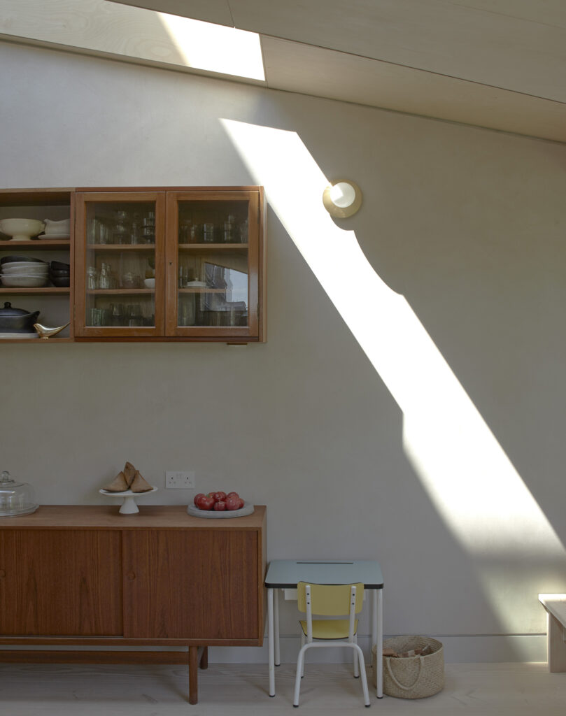A shaft of light coming through the rooflight in the Kitchen at our Douglas House project in Kensal Rise, NW London