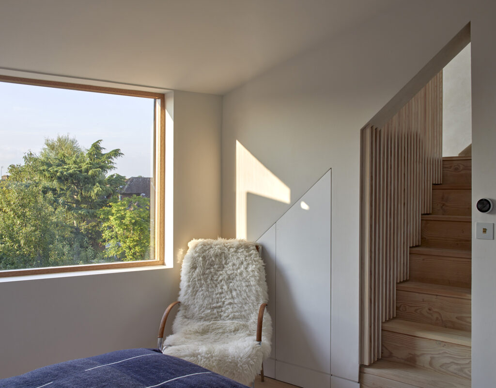 image of loft bedroom with Dinesen Doulgas Fir used for the floor and stairs up to the reading nook