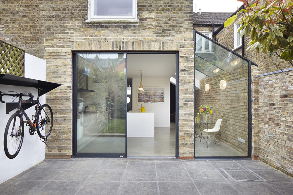 photo of rear of Burrows Road Glazed Envelope in Kensal Rise, NW London by architects RISE Design Studio