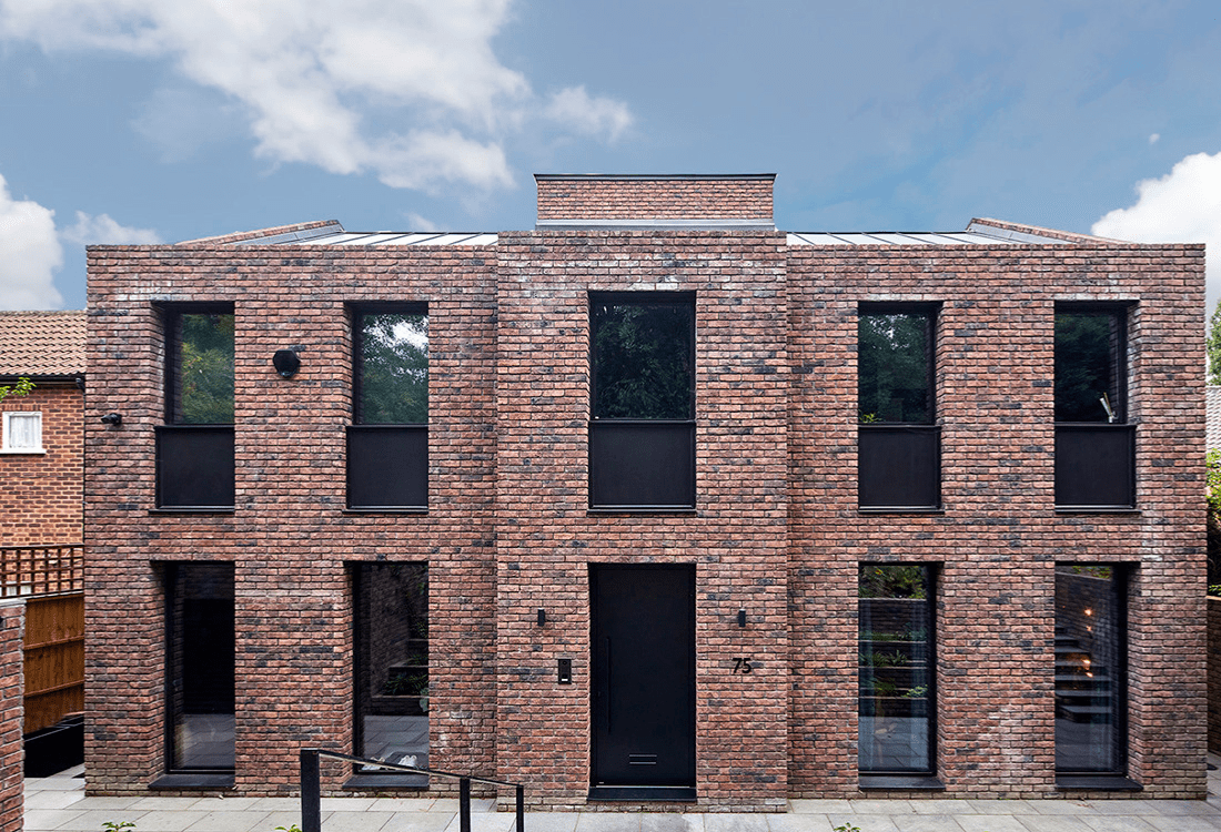 A contemporary brick building with symmetrical design that blends traditional brickwork with modern architectural lines, showcasing the fusion of legacy materials and classic aesthetics with innovative techniques and sustainable architecture.