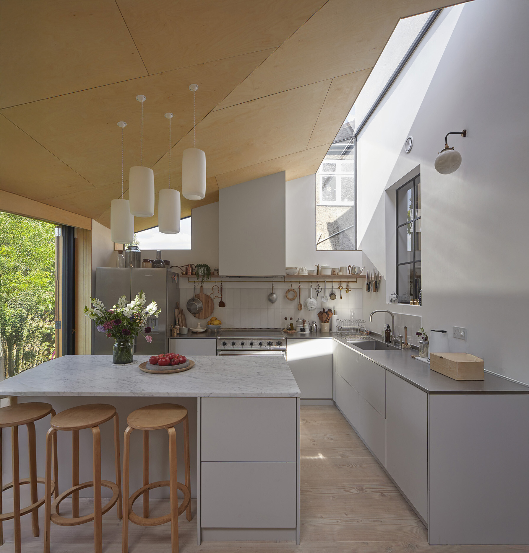 Kitchen in Low Energy Home with Birch plywood clad ceiling and Dinesen Douglas Fir floor and bespoke kitchen cabinets